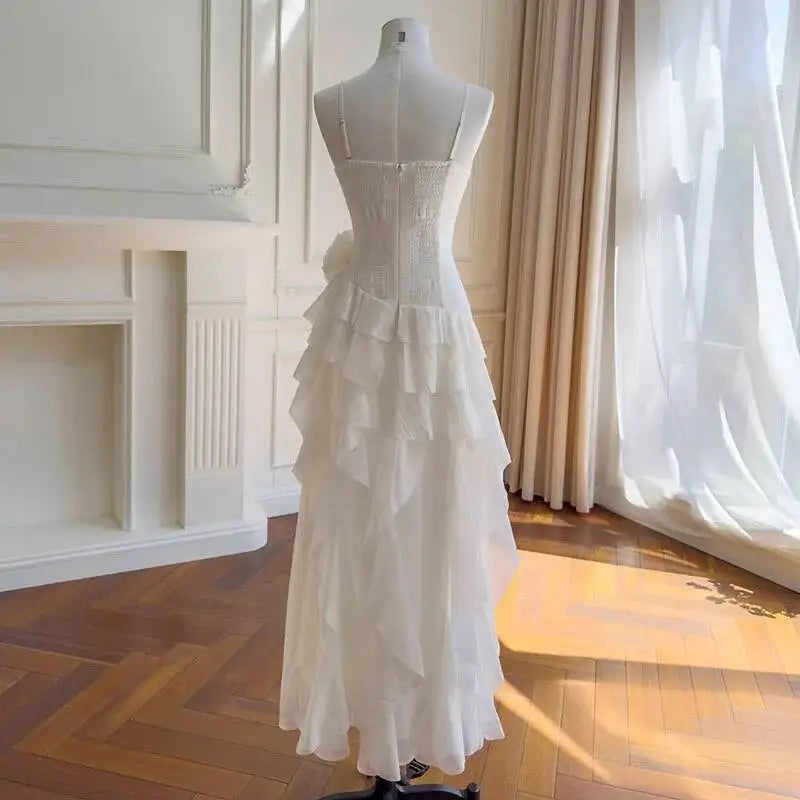 Back view of a strapless ruffle trim dress on a mannequin