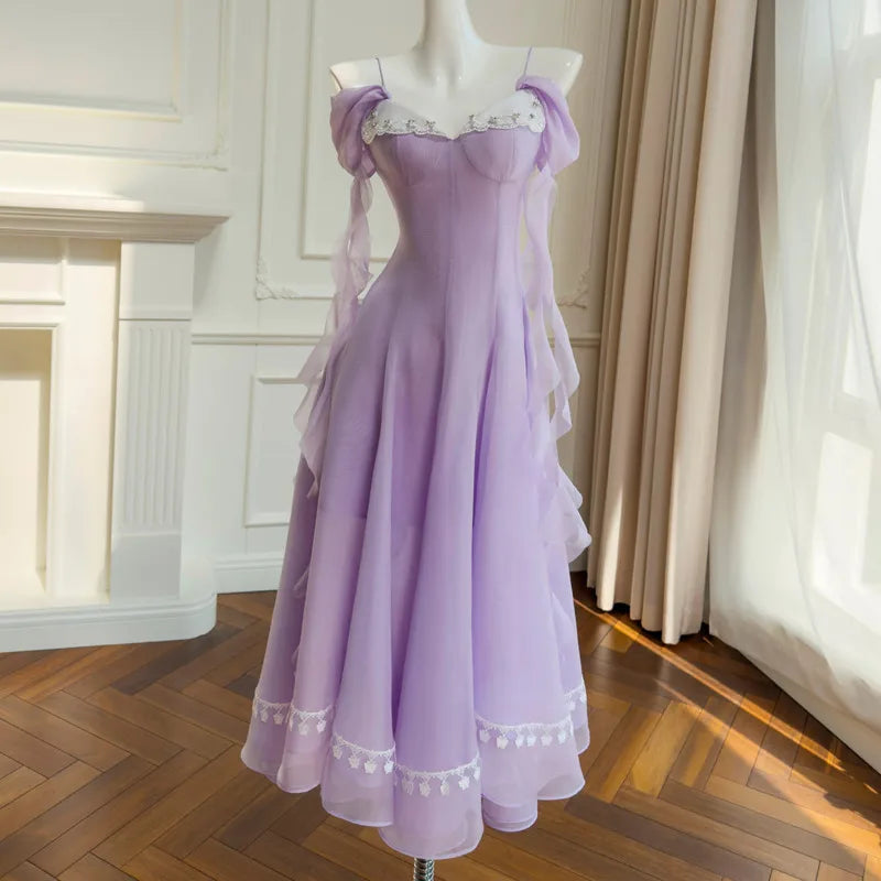 Off-shoulder gauze A-line midi dress with lace trim and chiffon sleeves.