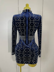 Navy blue dress with white geometric patterns on a mannequin against a white background
