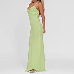 Woman wearing a light green dress on a white background
