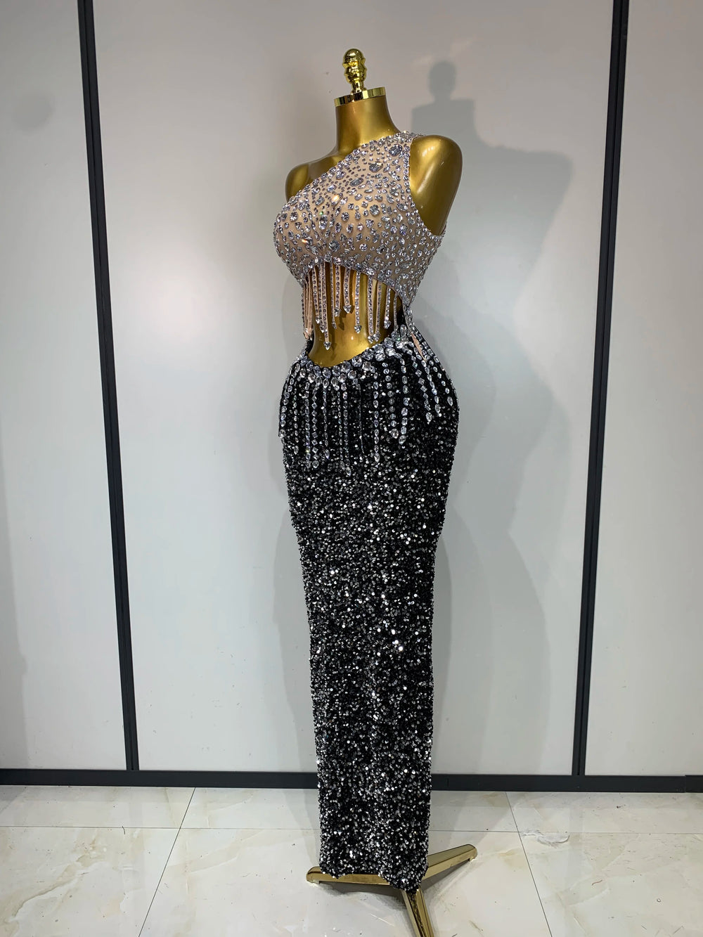 One-shoulder rhinestone dress, side view.