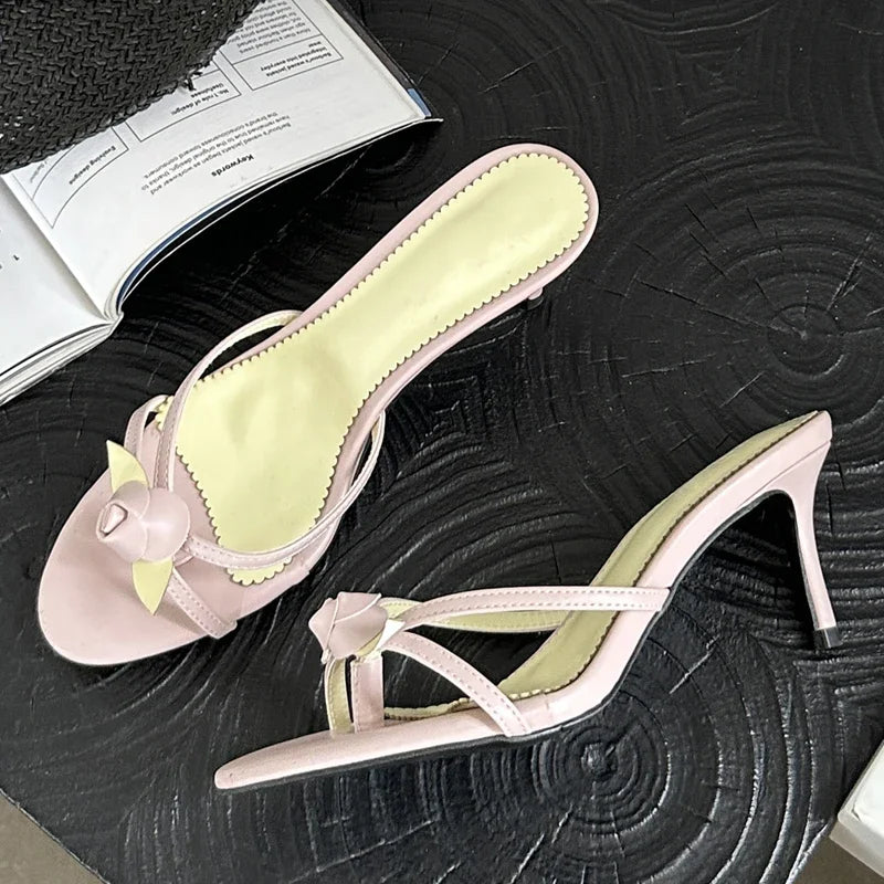 Pink flower embellished thin heel mules