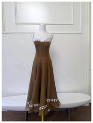 Brown lace-trimmed A-line midi dress on mannequin, front view