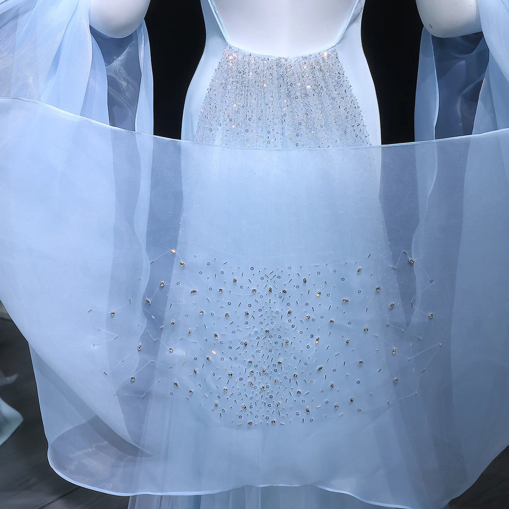 Light blue dress with sparkling embellishments on a mannequin