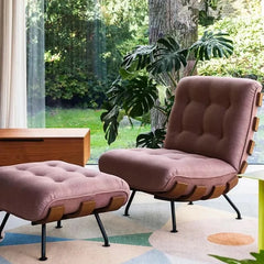 Sculptural reading chair in a light luxury interior setup