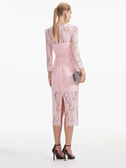 Woman wearing a pink lace dress