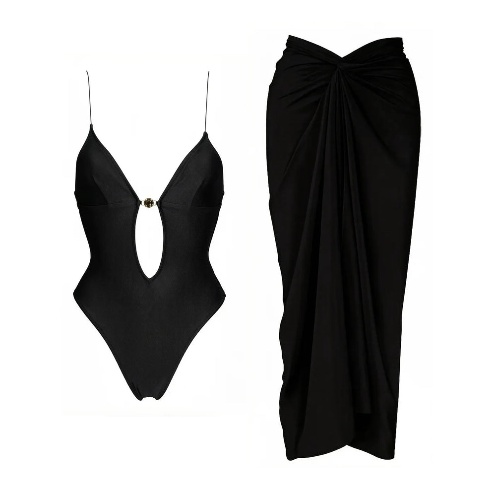 Black monochrome two-piece swimwear set with cutout detail and matching draped skirt.