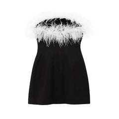 Women's feather dress with a backless design.