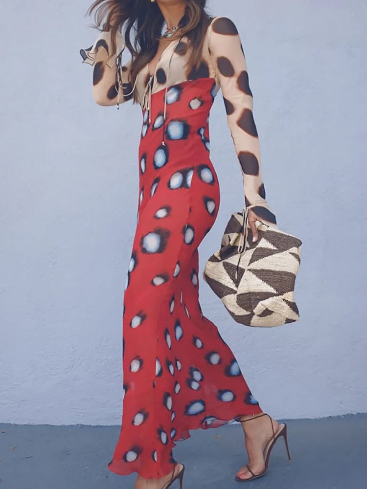 Model holding a woven bag with a tie neck maxi dress.