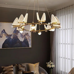 Modern chandelier hanging in a living room with a dark wall and window.