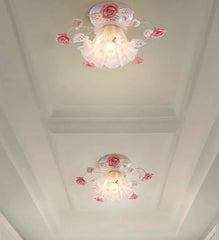 Ceiling lights with floral design on a white ceiling