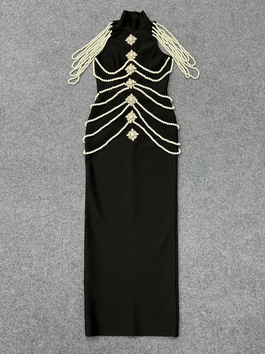 Flat lay of black high neck sleeveless maxi dress with pearl and crystal embellishments