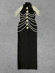 Flat lay of black high neck sleeveless maxi dress with pearl and crystal embellishments