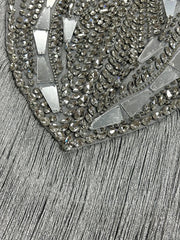 Detail of crystal beads and fringe on dress