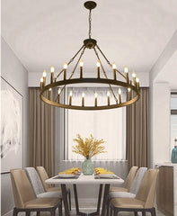 Dining room with a large chandelier, table, and chairs.