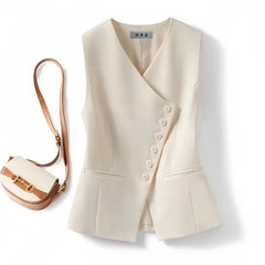Beige vest with buttons and a matching handbag on a white background