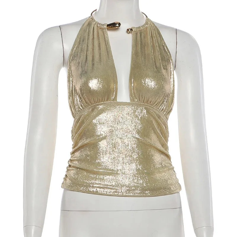 Gold sequin top on a mannequin against a white background