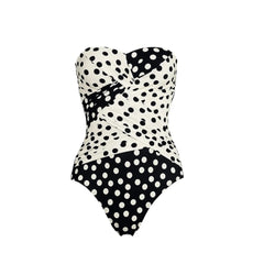 Polka dot strapless swimwear with asymmetrical wrap detail.
