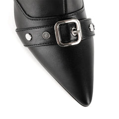 Detail of buckle and rivet accents on black faux leather boots