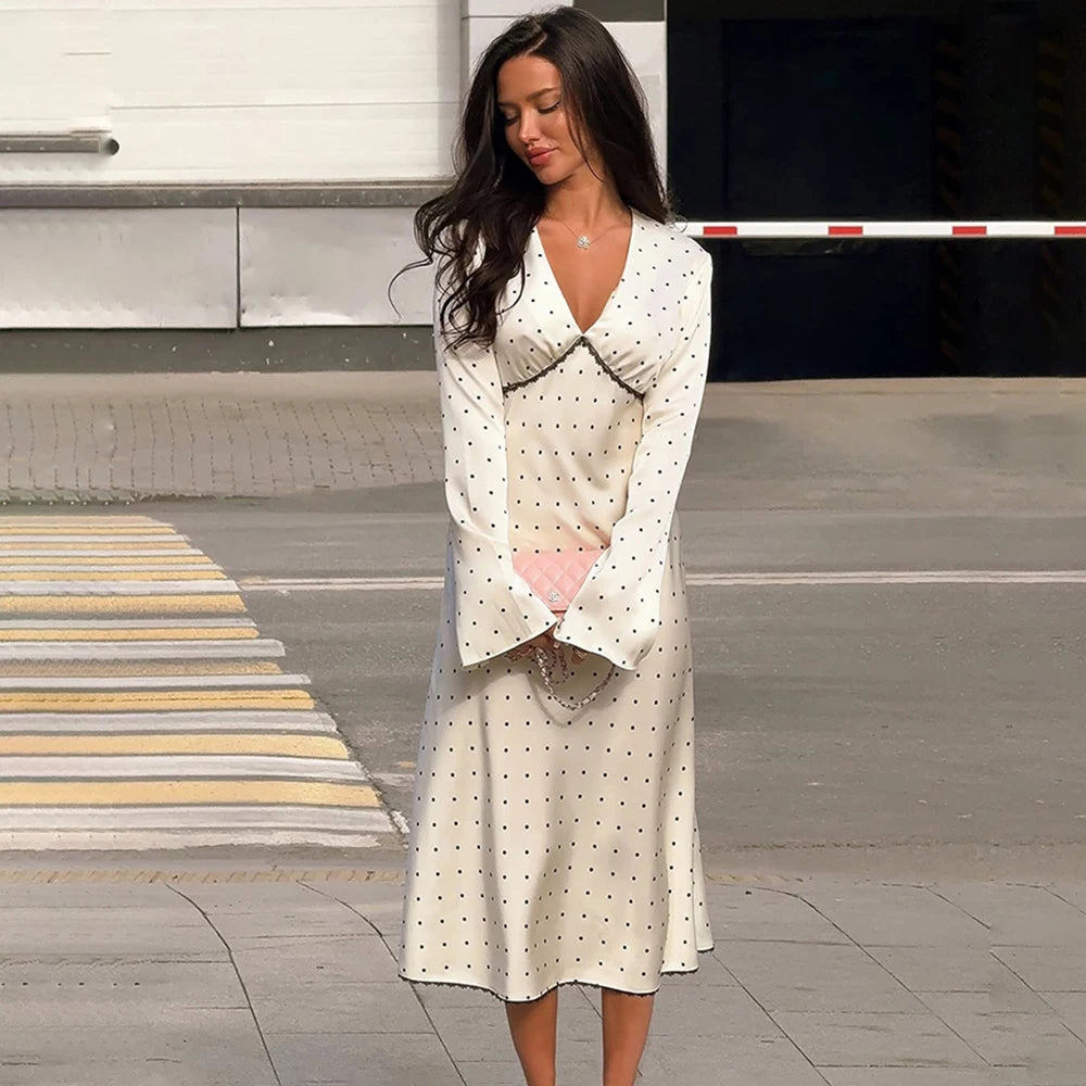White polka dot v-neck dress with black polka dots
