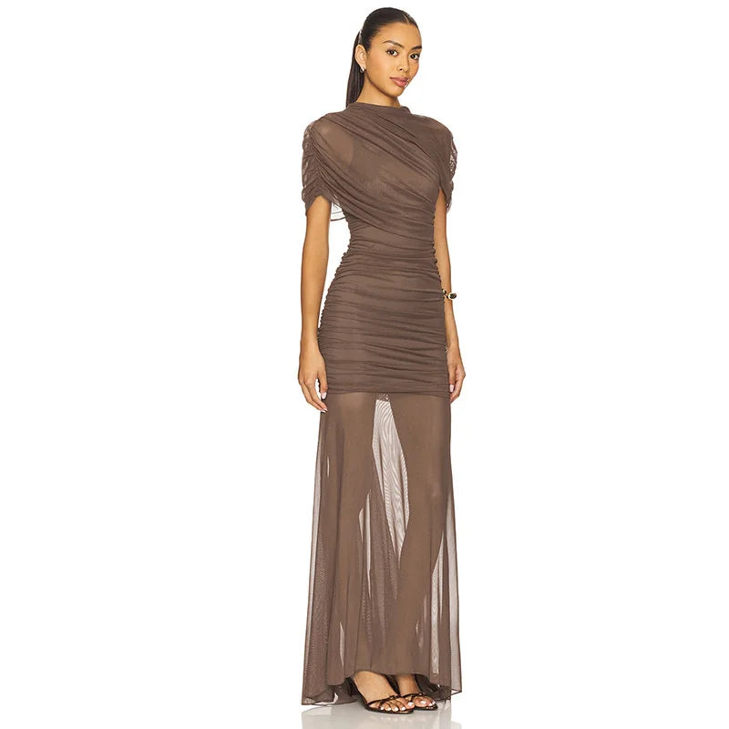 Woman wearing a brown evening gown on a white background