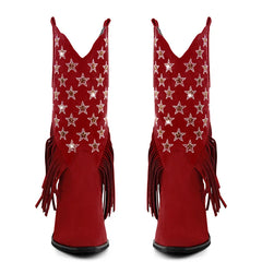 Red cowboy boots with star patterns and fringes on a white background