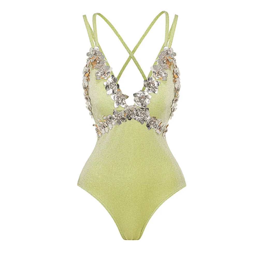 Close-up of the embellished neckline on the sparkling swimsuit.
