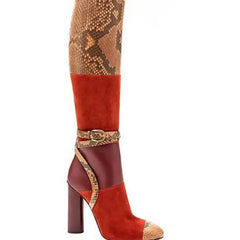 Patchwork snake print knee-high dress boots with a buckle strap and chunky square heel.
