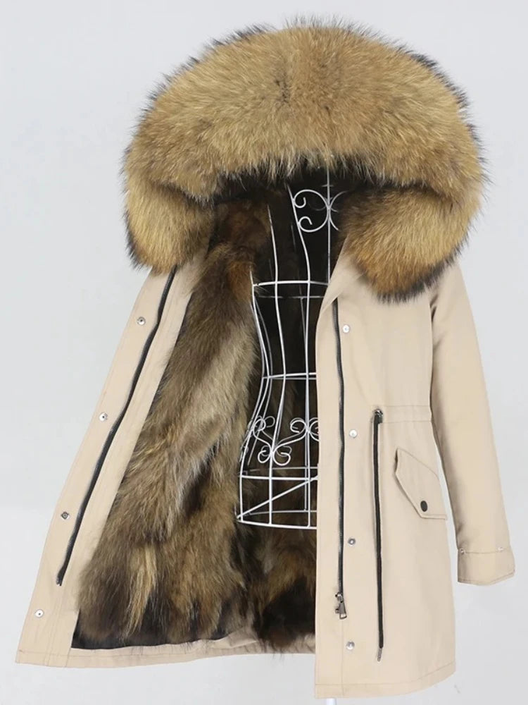 Beige parka coat with a large fur hood on a white background
