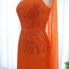  Close-up of the cape sleeves and vibrant orange color of the evening dress. Golden Atelier 2