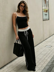 Black camisole top and wide-leg pants set with polka dot trim