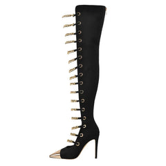 Black knee-high boot with gold accents on a white background