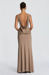 Back view of sleeveless high slit column gown in khaki