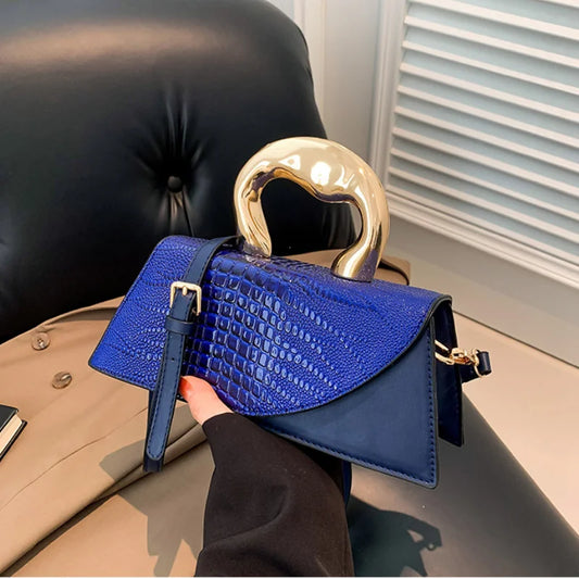 Blue alligator textured top handle bag with golden handle