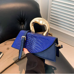 Blue alligator textured top handle bag with golden handle
