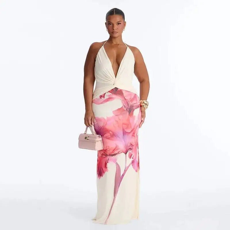 Plus-size model in a pink floral print halter neck maxi dress