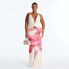 Plus-size model in a pink floral print halter neck maxi dress