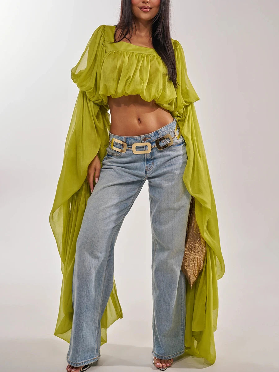 Lime green draped square neck crop top with wide-leg jeans and a gold mesh bag.