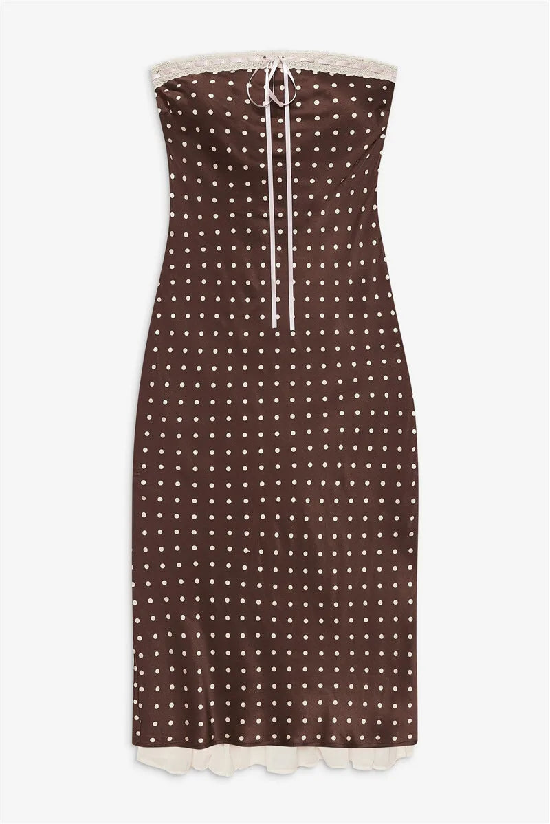Brown strapless dress with white polka dots on a white background