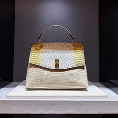 Cream embossed leather satchel bag with snake print flap
