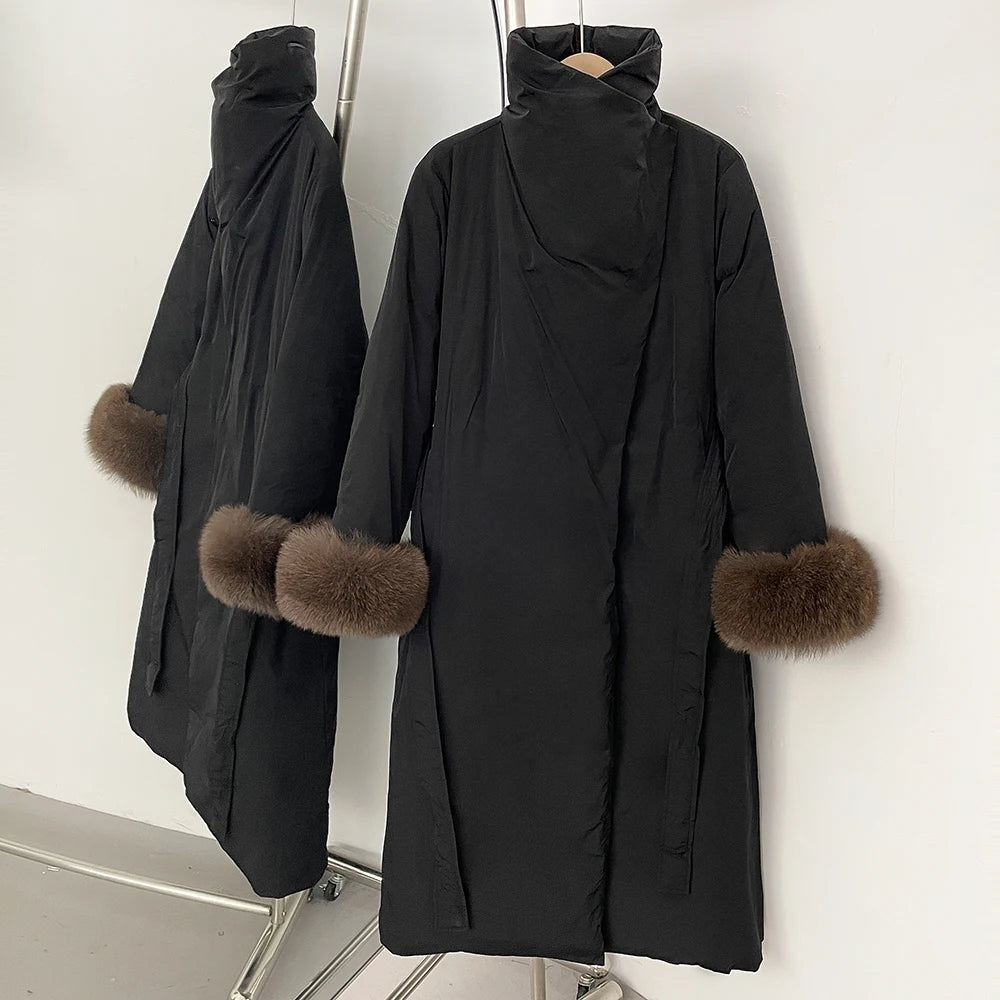 Black coat with fur cuffs on a mannequin against a white background
