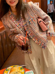 A woman wearing a colorful rainbow wool coat with an open stitch design, perfect for spring and summer. Golden Atelier  3