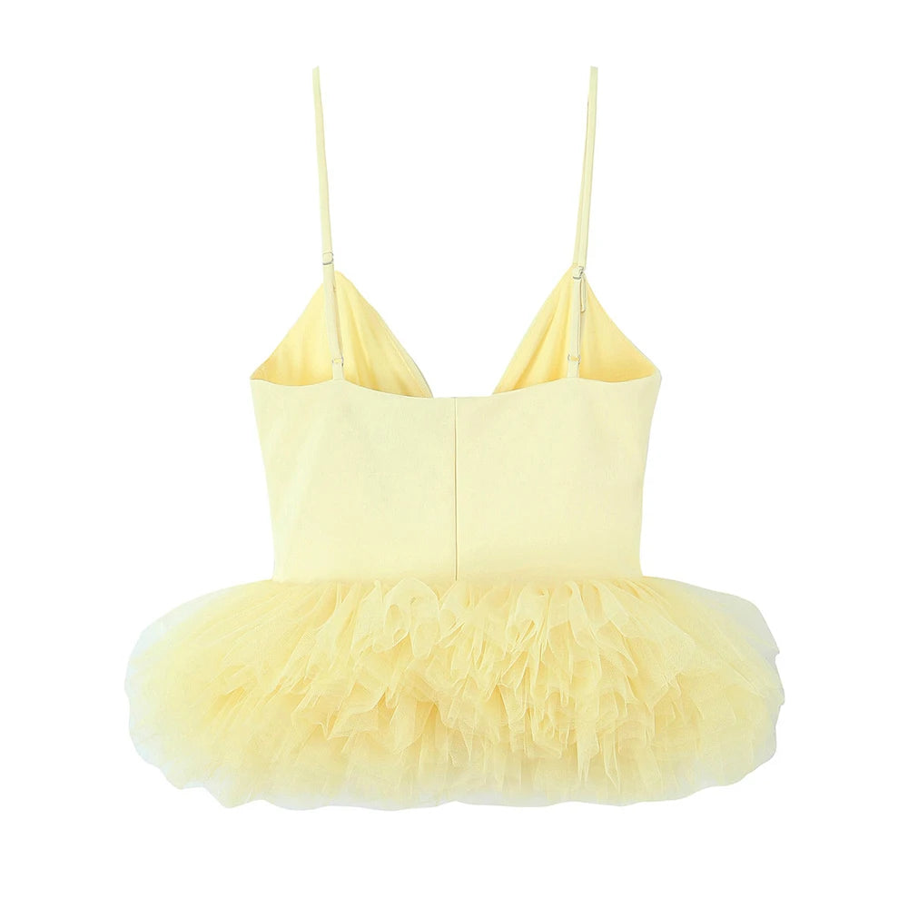 Yellow dress with feathered skirt on a white background
