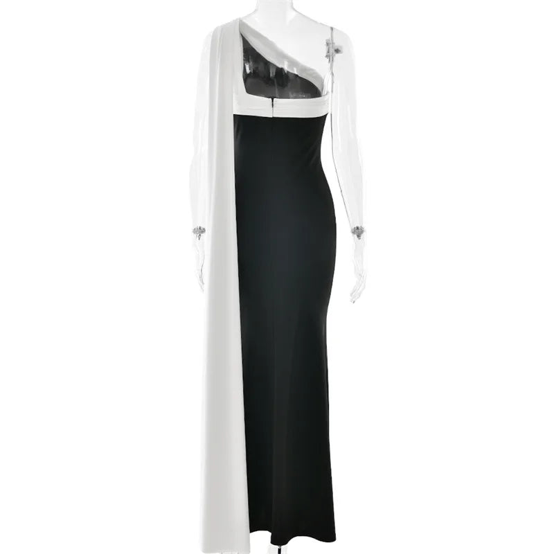 Black and white evening gown on a mannequin against a white background