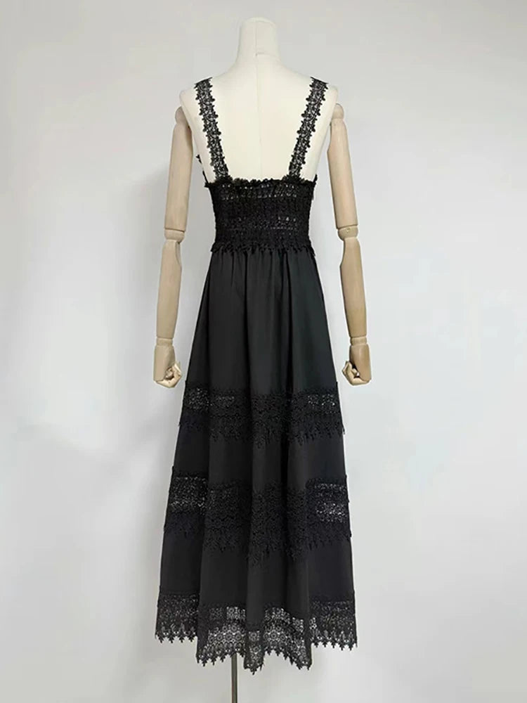 Black lace dress on a mannequin against a white background