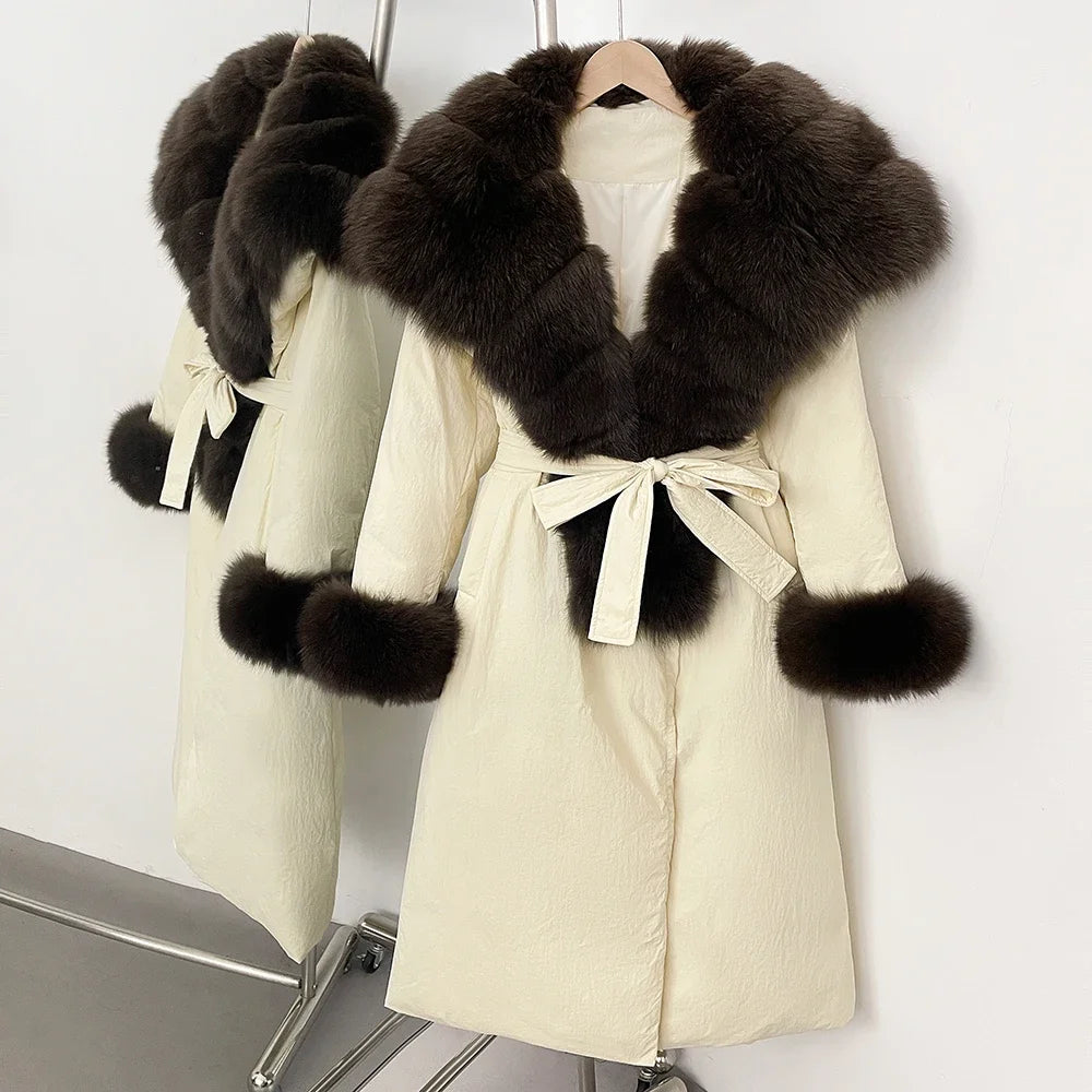 Beige coat with dark fur trim on a white background