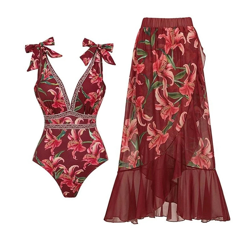 Floral print V-neck tie-shoulder one-piece swimsuit with a ruffled wrap skirt.