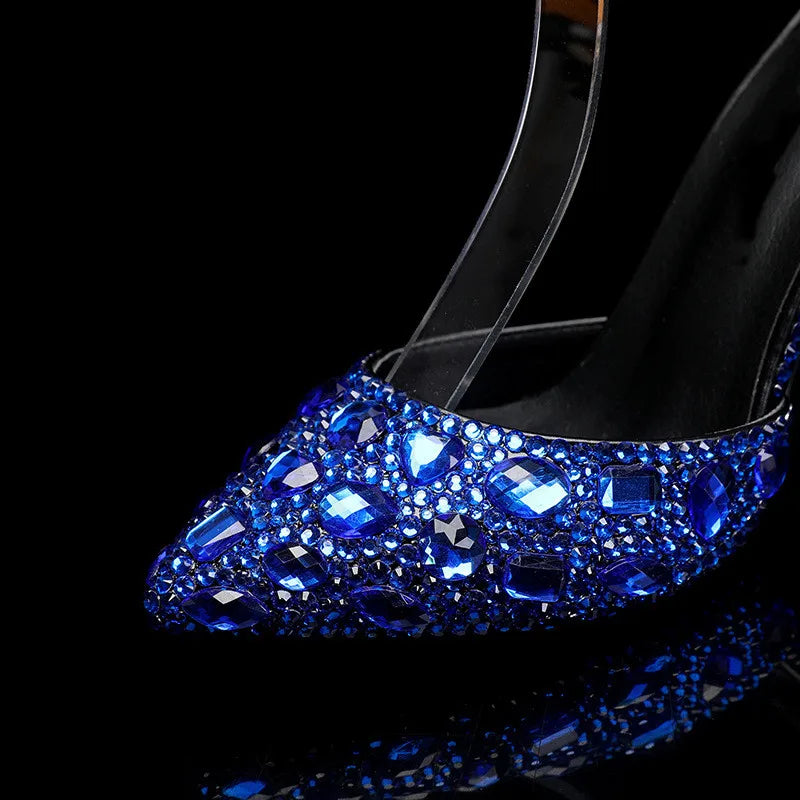Blue crystal-embellished high-heeled shoes on a black background