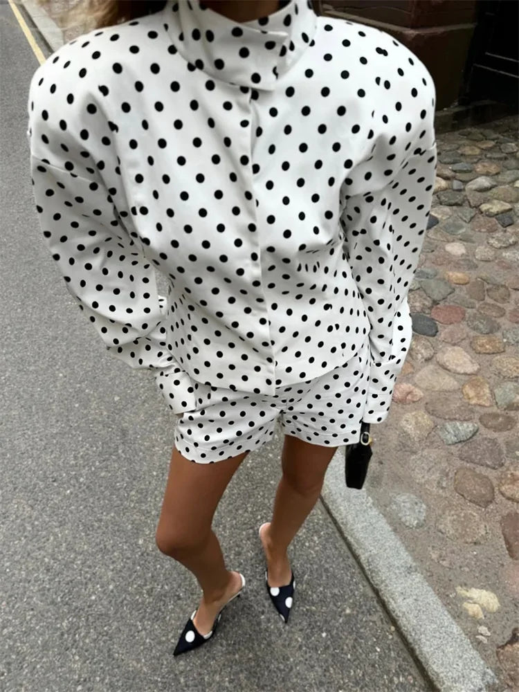 Person wearing a polka dot dress on a street