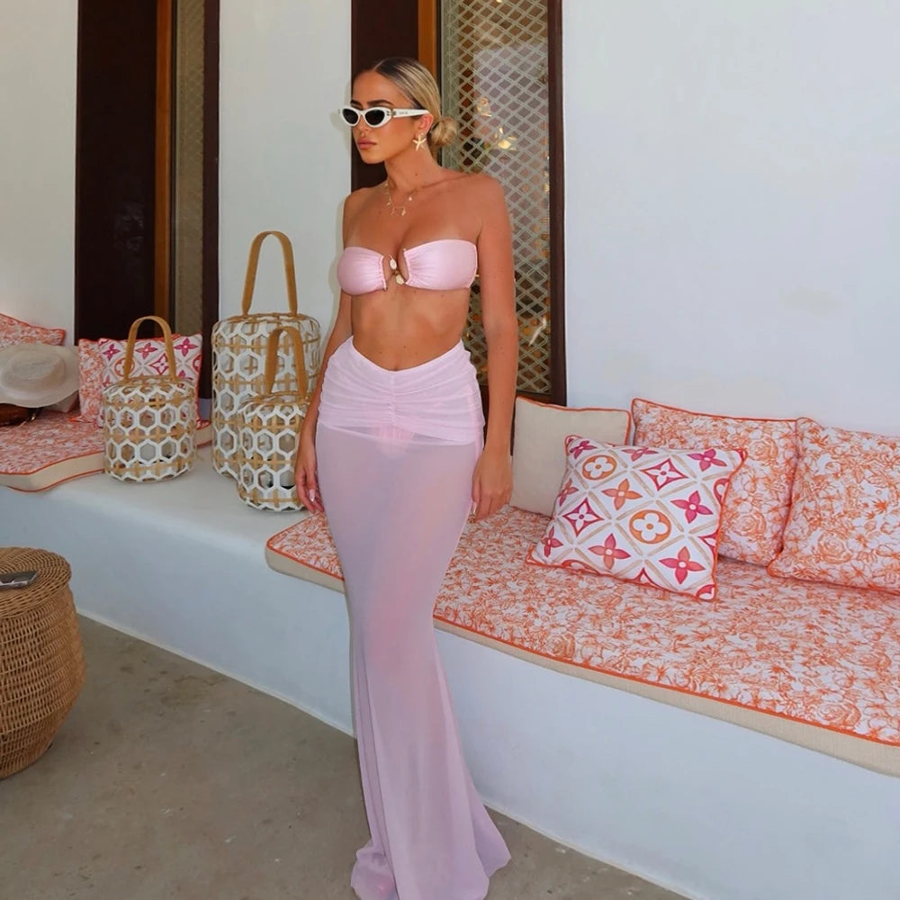 Pink bikini top and sheer maxi skirt